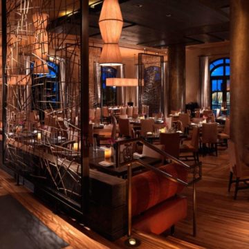 Elegant restaurant interior with mood lighting and sophisticated decor.