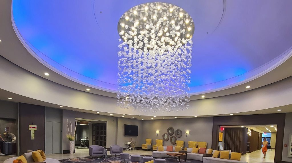 Elegant hotel lobby with modern bubble chandelier lighting