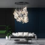 Modern living room with chic sofa and unique hanging light fixture.